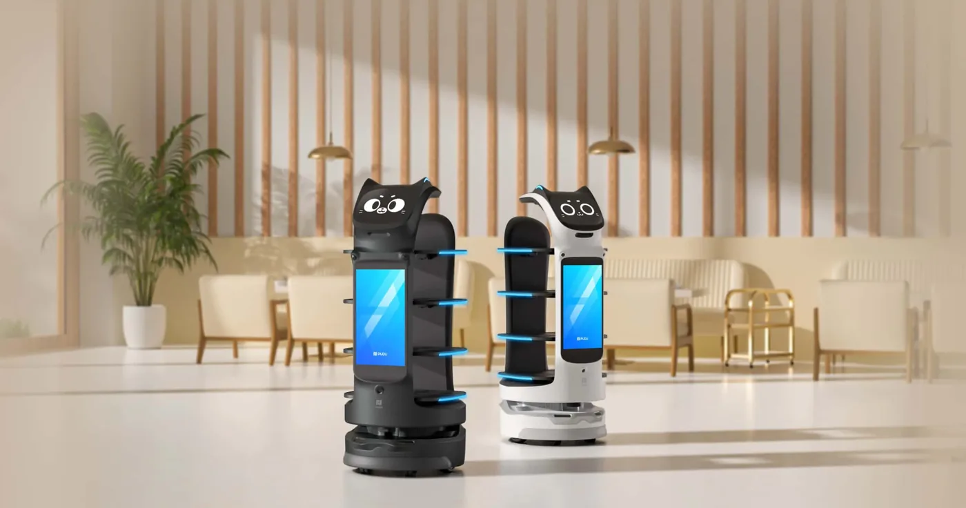 Two tray-service delivery robots waiting in a restaurant