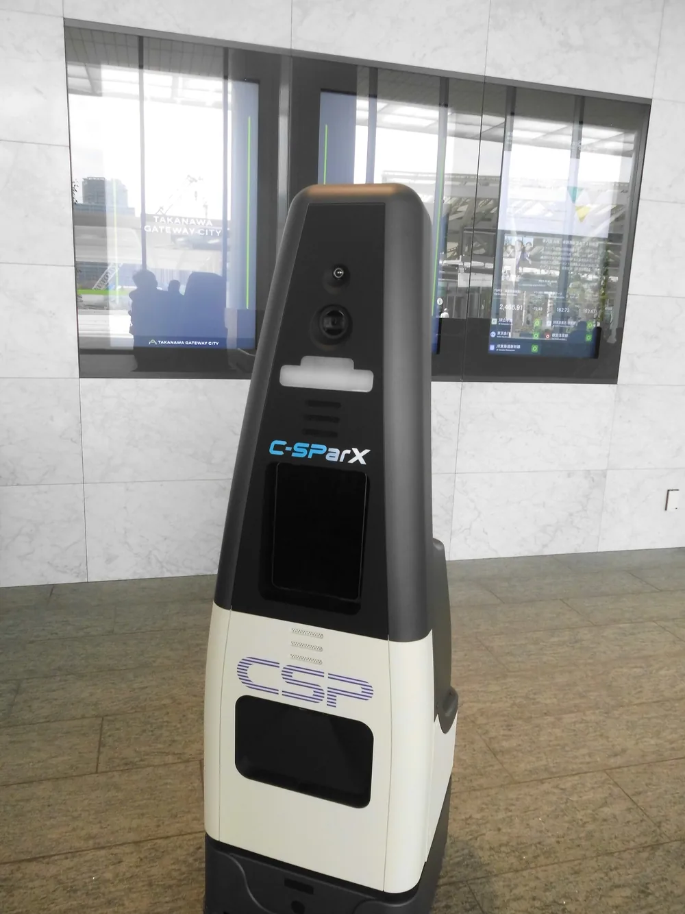 A security patrol robot on duty in a building lobby